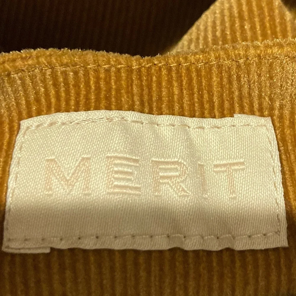 Merit brown corduroy signature tie top make up bag.